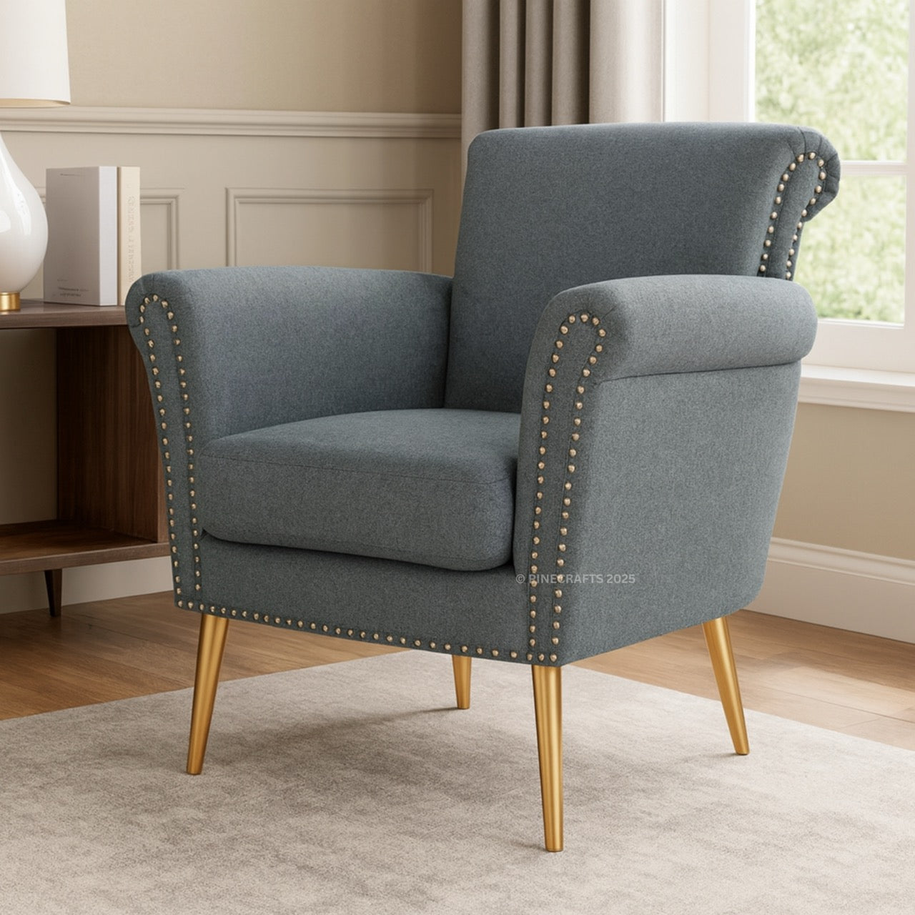 Gray armchair with gold legs in a room setting